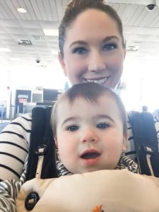 mom and baby in baby carrier at airport