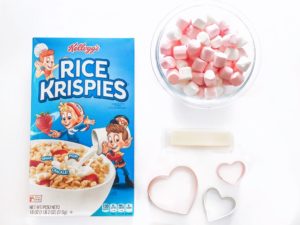 box of Rice Krispies pink and white marshmallows stick of butter heart-shaped cookie cutters