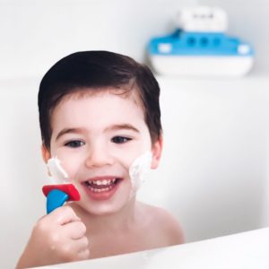 toddler pretend shaving during bathtime