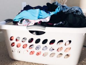 tips for cleaner home; laundry basket full of clean clothes
