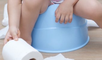 child-potty-training-reaching-for-roll-of-toilet-paper
