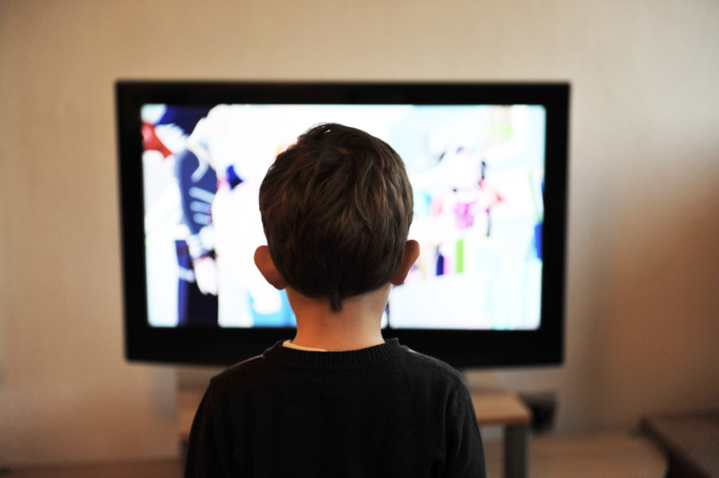 kid-looking-at-a-television